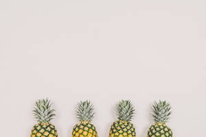 Four Pineapples On White Background Wallpaper