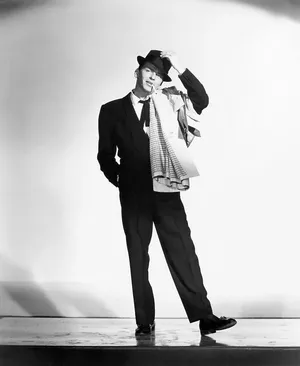 Frank Sinatra Standing On A Stage Wallpaper