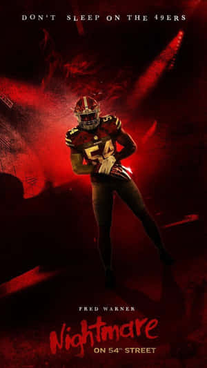 Fred Warner Dominating On Field In A Night Game Wallpaper