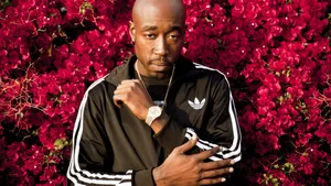 Freddie_ Gibbs_ Amidst_ Red_ Blooms Wallpaper