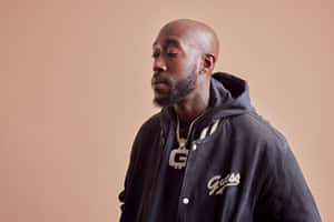 Freddie Gibbs Contemplative Look Wallpaper