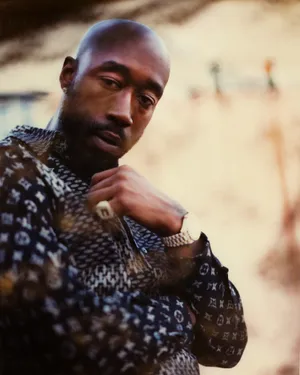 Freddie Gibbs Contemplative Pose Wallpaper