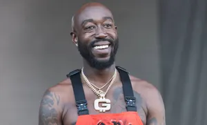Freddie Gibbs Smiling Performance Wallpaper