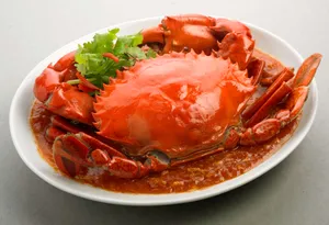 Fresh Chilli Crab On White Platter Wallpaper
