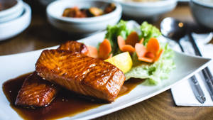 Freshly Cooked Salmon With Soy Sauce And Vegetables Wallpaper