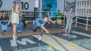 Friends Playing Royal Palms Shuffleboard Club In Brooklyn Wallpaper