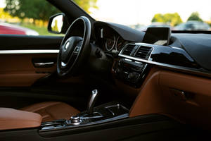 Front Seat Inside A Black Bmw Wallpaper