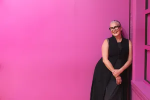 Fuchsia Pink Wall With Woman Posing Wallpaper