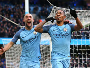 Gabriel Jesus With Another Player Cheering Wallpaper