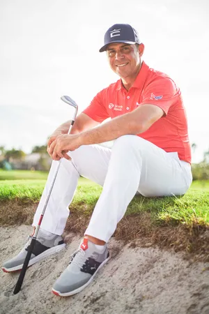 Gary Woodland Sitting On Grass Wallpaper