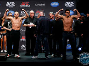 Georges St-pierre And Nick Diaz Face-off During The Weigh-in Wallpaper