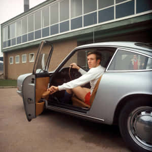German Football Star Günter Netzer With Vintage Porsche Car Wallpaper