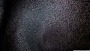 Get The Luxurious Look And Feel Of Black Leather Wallpaper