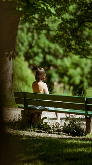 Girl Alone At A Park Wallpaper