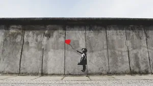 Girl With Balloon In Berlin Wall Wallpaper