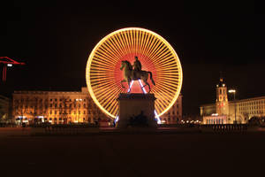 Glowing Ferris Wheel In France Wallpaper