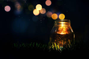 Glowing Jar On Quiet Night Wallpaper