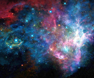 Glowing Rainbow Galaxy In Vast Universe Wallpaper