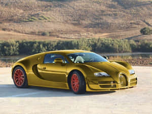 Go For A Luxurious Ride In The World-renowned Gold Bugatti Veyron Car. Wallpaper