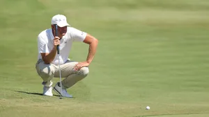 Golfer Lucas Glover Reflective On The Golf Course Wallpaper