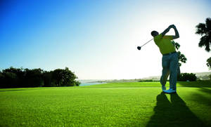 Golfer Strike In Golf Course Wallpaper