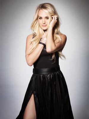Grammy-winning Artist Carrie Underwood Glows In Concert Wallpaper