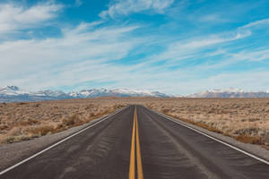 Gray Concrete Road Under Blue Sky During Daytime Wallpaper