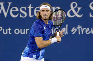 Greek Tennis Prodigy Stefanos Tsitsipas Perfecting A Backhand Stroke Wallpaper