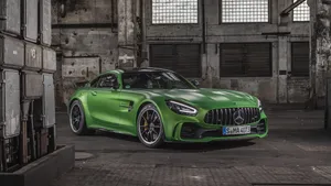 Green Amg Parked In Large Garage Wallpaper