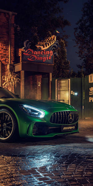 Green Amg Parked Outside Dancing Dingie Wallpaper