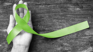 Green Ribbon For Mental Health Awareness Wallpaper