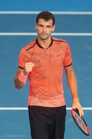 Grigor Dimitrov In Eye-catching Orange Shirt Wallpaper