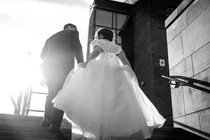 Groom And Bride On Staircase Wallpaper