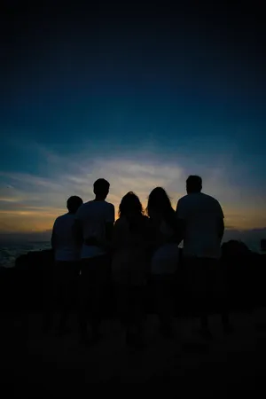 Group Of Friends Silhouette Looking At The Skies Wallpaper