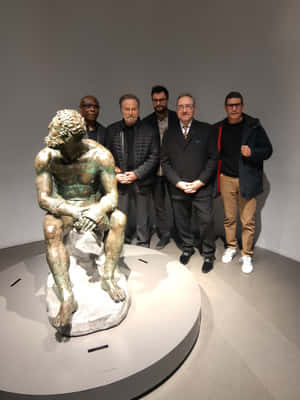 Groupof Menwith Bronze Statue Wallpaper