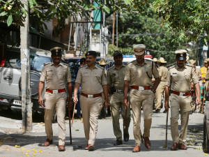 Guardians Of Peace: Indian Police Patrolling Public Areas Wallpaper