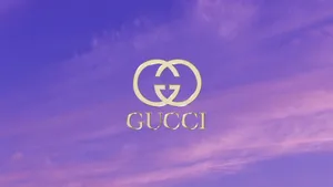 Gucci Logo On A Purple Sky Wallpaper