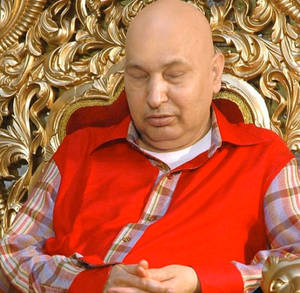 Guru Ji Sleeping In Chair Wallpaper