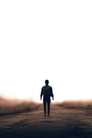 Guy On An Empty Road Wallpaper