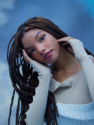 Halle Bailey Portrait Blue Backdrop Wallpaper