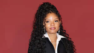 Halle Bailey Red Background Portrait Wallpaper