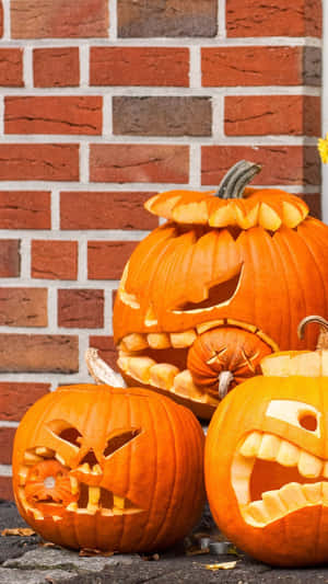 Halloween Pumpkin Carvings Brick Backdrop Wallpaper