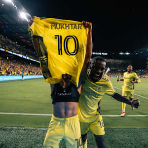 Hany Mukhtar Raising Football Jersey Uniform Wallpaper