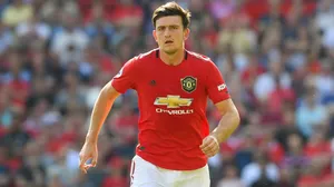 Harry Maguire Sprinting Mid Field Wallpaper