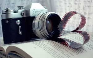 Hd Camera On A Book Wallpaper