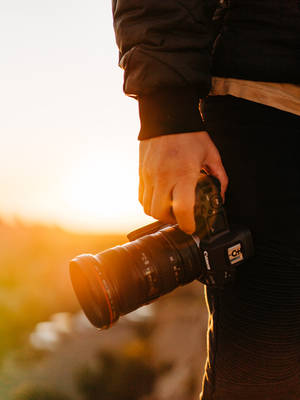 Hd Photography Of A Hand Holding A Camera Wallpaper