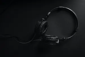 Headphones Against Black Pc Wallpaper