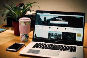 High-end Dell Laptop On A Table Wallpaper