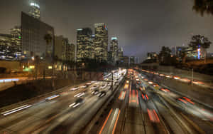 Highway Busy With Passing Cars Wallpaper