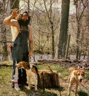 Hillbilly Jim Waving With Dogs Outdoors Wallpaper
